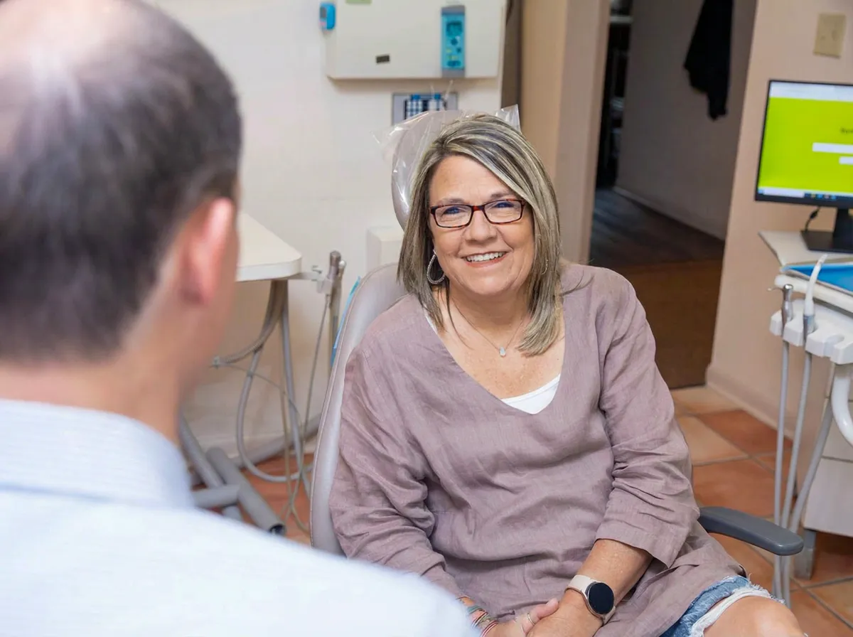 Smiling patient in the treatment chair