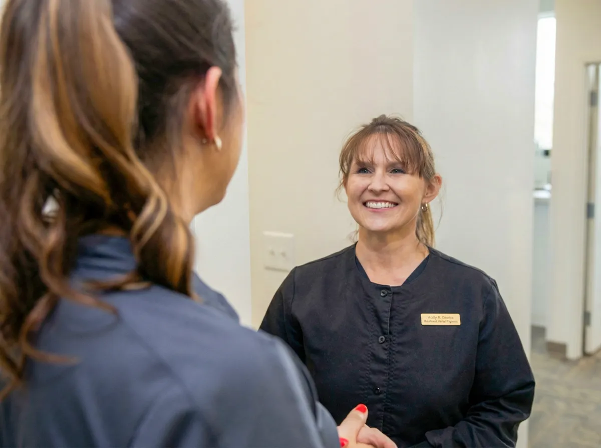 Staff member greeting with a handshake