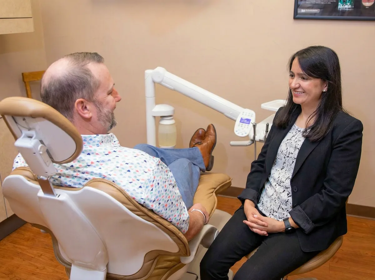 Team member talking with a patient before treatment
